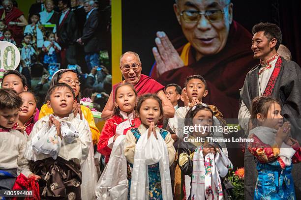 Children sing Happy Birthday to The XIV Dalai Lama during his 80th birthday celebrations at the 'Jahrhunderthalle' on July 13, 2015 in Frankfurt,...