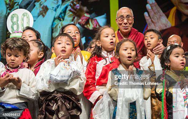 Children sing Happy Birthday to The XIV Dalai Lama during his 80th birthday celebrations at the 'Jahrhunderthalle' on July 13, 2015 in Frankfurt,...