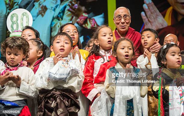 Children sing Happy Birthday to The XIV Dalai Lama during his 80th birthday celebrations at the 'Jahrhunderthalle' on July 13, 2015 in Frankfurt,...