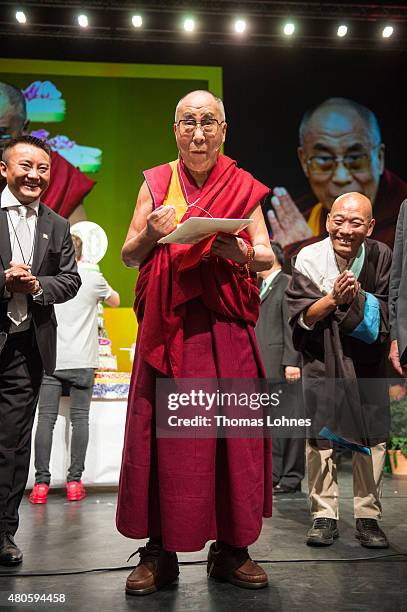 The XIV Dalai Lama eats birthday cake during his 80th birthday celebrations at the 'Jahrhunderthalle' on July 13, 2015 in Frankfurt, Germany.