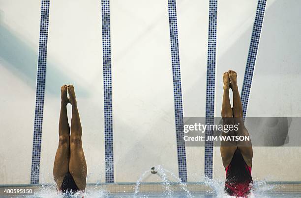 Yaima Mena and Annia Rivera of Cuba compete in the Women's Synchronized 10M Platform finals at the 2015 Pan American Games in Toronto, Canada, July...