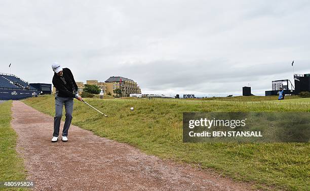 Golfer Daniel Berger chips onto the 17th green during a practice round on The Old Course at St Andrews in Scotland, on July 13 ahead of The 2015 Open...