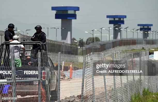 Federal Police officers patrol the perimeter of the Altiplano prison in Almoloya de Juarez, Mexico, on July 13, 2015 a day after the government...