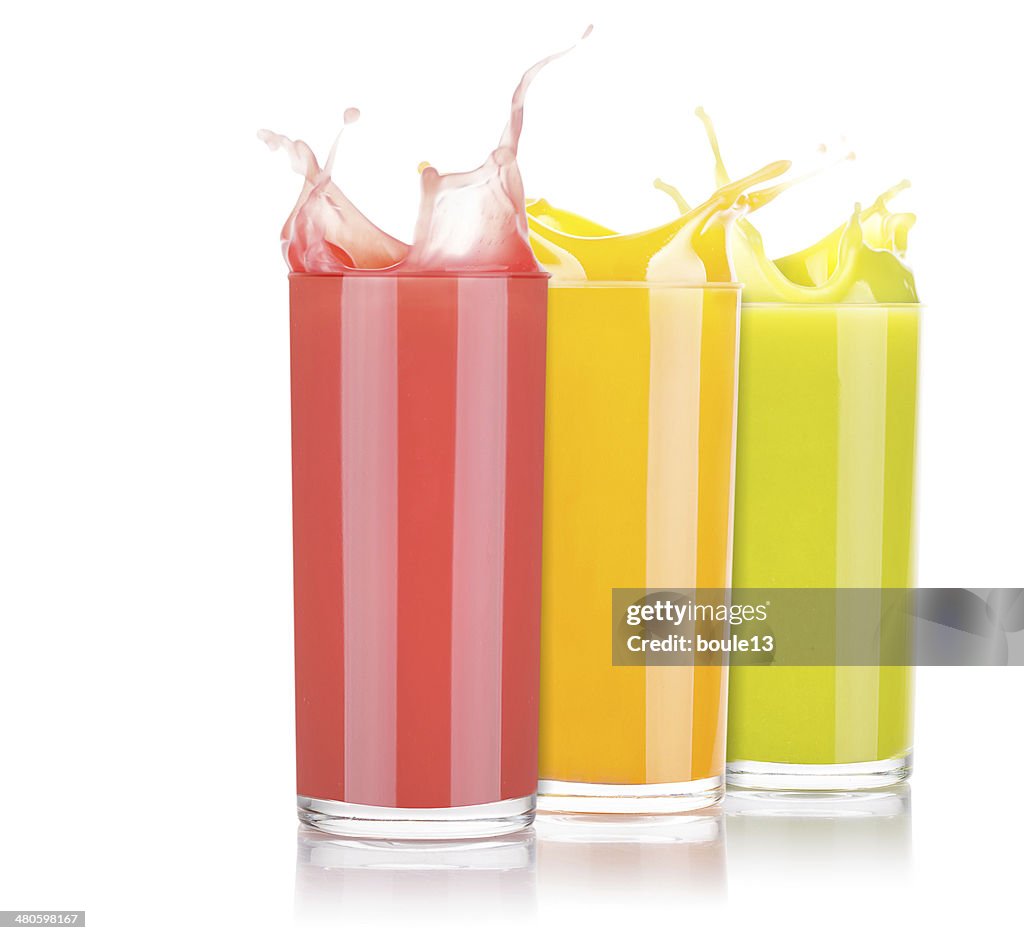 Tasty summer fruit drinks in glass with splash