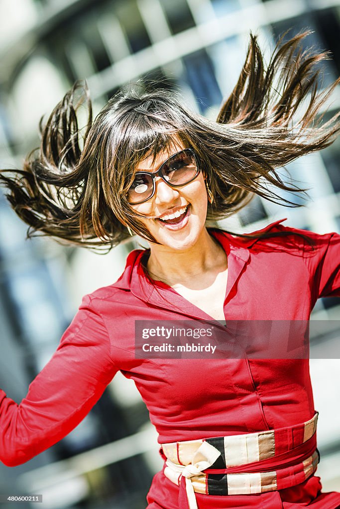 Young adult woman in red dress