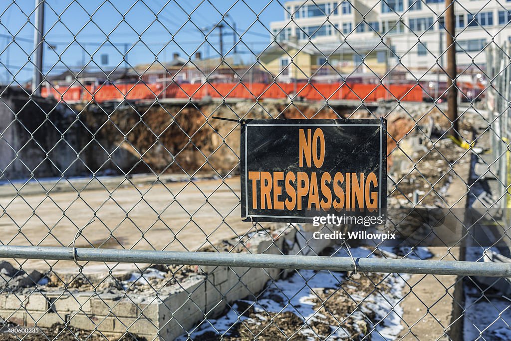 NO TRESPASSING Sign At Demolition Site