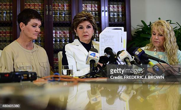 Attorney Gloria Allred displays a copy of excerpts released from Bill Cosby's deposition in the Constand lawsuit on July 13, 2015 in Los Angeles,...