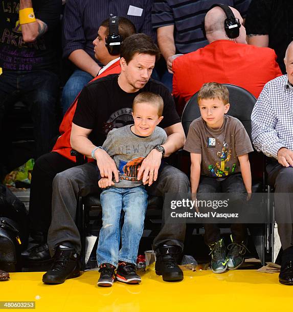 Mark Wahlberg, Brendan Joseph Wahlberg and Michael Robert Wahlberg attend a basketball game between New York Knicks and the Los Angeles Lakers at...