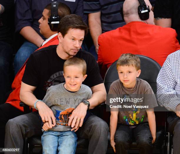 Mark Wahlberg, Brendan Joseph Wahlberg and Michael Robert Wahlberg attend a basketball game between New York Knicks and the Los Angeles Lakers at...