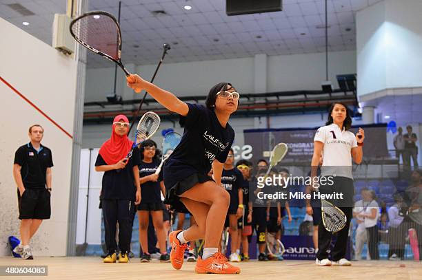 Squash player Nicol David interacts with young players as she visits a childrens clinic at Bukit Jalil School ahead of the 2014 Laureus World Sports...
