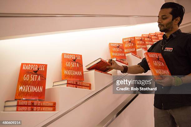 Staff member at Foyles book shop prepare to sell copies of "Go Set A Watchman" by Harper Lee, available shortly after midnight, on July 13, 2015 in...