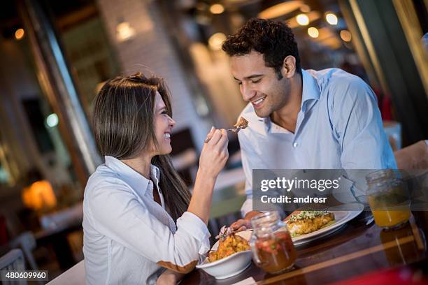 loving couple in a romantic dinner - romantische activiteit stockfoto's en -beelden