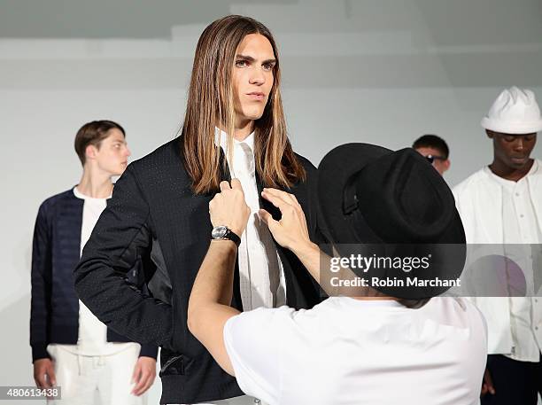 Model prepares backstage at Matiere Presentation during New York Fashion Week: Men's S/S 2016 at Industria Superstudio on July 13, 2015 in New York...