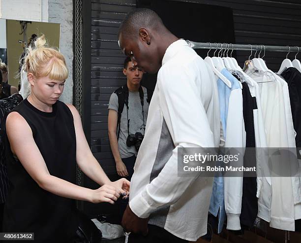 Model prepares backstage at Matiere Presentation during New York Fashion Week: Men's S/S 2016 at Industria Superstudio on July 13, 2015 in New York...