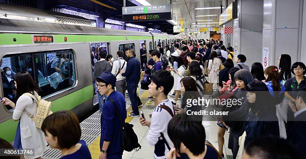 commuters in the tokyo subway - japanese exit sign stock pictures, royalty-free photos & images