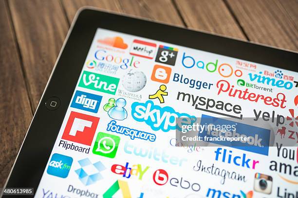 black ipad showing the most famous website - google social networking service stock pictures, royalty-free photos & images