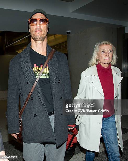 Matthew McConaughey and his mother Mary McCabe are seen at Los Angeles International airport on March 25, 2014 in Los Angeles, California.