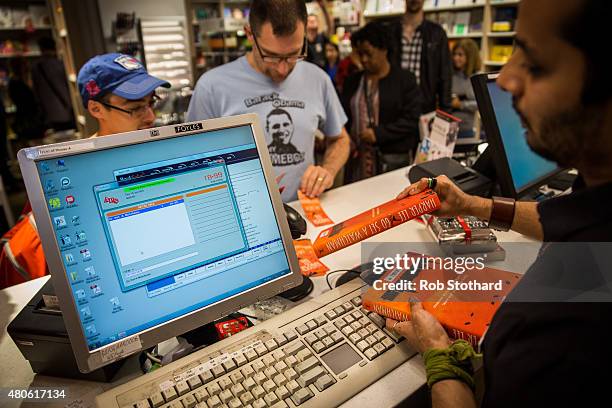 People buy "Go Set A Watchman" by Harper Lee shortly after midnight at Foyles book shop on July 14, 2015 in London, England. Go Set a Watchman was...