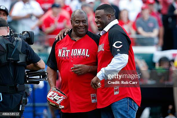 Ken Griffey Jr. Hugs his father Ken Griffey Sr. After throwing out the first pitch prior to the Gillette Home Run Derby presented by Head & Shoulders...