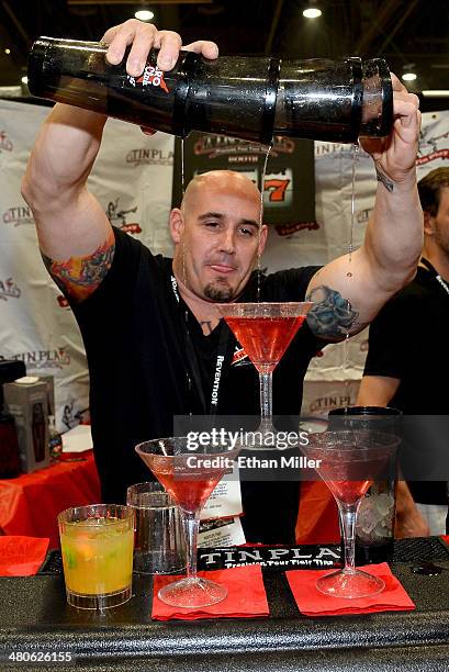 Bartender pours drinks at the Tin Play booth at the 29th annual Nightclub & Bar Convention and Trade Show at the Las Vegas Convention Center on March...