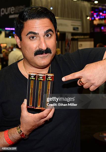 Television personality Reza Farahan displays his Phantom Smoke hookah products at the 29th annual Nightclub & Bar Convention and Trade Show at the...