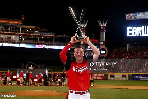 National League All-Star Todd Frazier of the Cincinnati Reds celebrates with the trophy after winning the Gillette Home Run Derby presented by Head &...