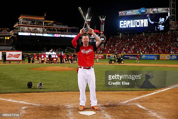 National League All-Star Todd Frazier of the Cincinnati Reds celebrates with the trophy after winning the Gillette Home Run Derby presented by Head &...