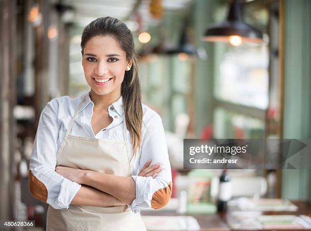 beautiful waitress working at a restaurant - woman waitress stock pictures, royalty-free photos & images