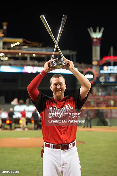 National League All-Star Todd Frazier of the Cincinnati Reds poses with the home derby championship trophy after the Gillette Home Run Derby...