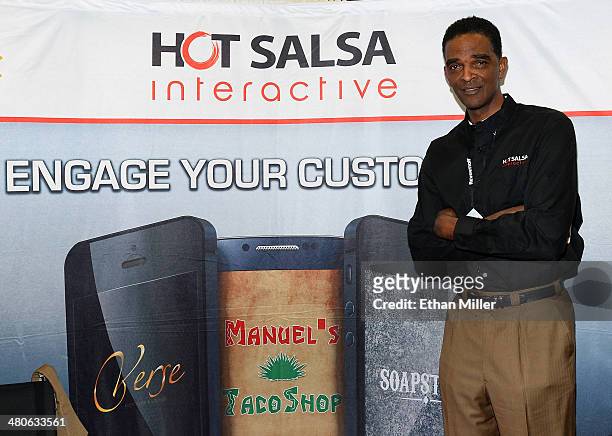 Former NBA player Ralph Sampson poses at the Hot Salsa Interactive booth at the 29th annual Nightclub & Bar Convention and Trade Show at the Las...