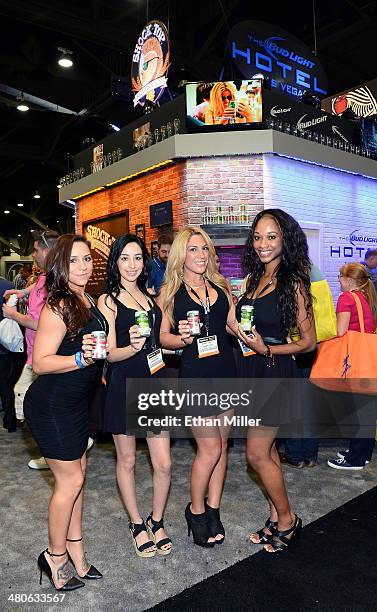 Promotional models pose at the Anheuser-Busch booth at the 29th annual Nightclub & Bar Convention and Trade Show at the Las Vegas Convention Center...