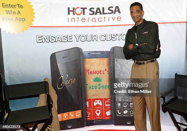Former NBA player Ralph Sampson poses at the Hot Salsa Interactive booth at the 29th annual Nightclub & Bar Convention and Trade Show at the Las...