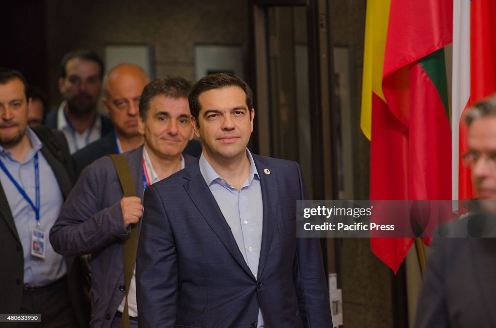 Greek Prime Minister Alexis Tsipras (front) and Greek...