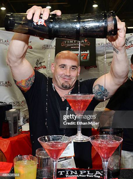 Bartender pours drinks at the Tin Play booth at the 29th annual Nightclub & Bar Convention and Trade Show at the Las Vegas Convention Center on March...