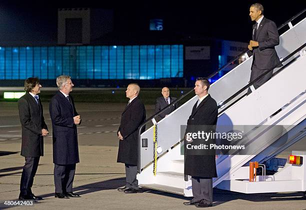 President Barack Obama is welcomed by King Philippe of Belgium and Belgian Prime Minister Elio Di Rupo as he disembarks from Air Force One at...