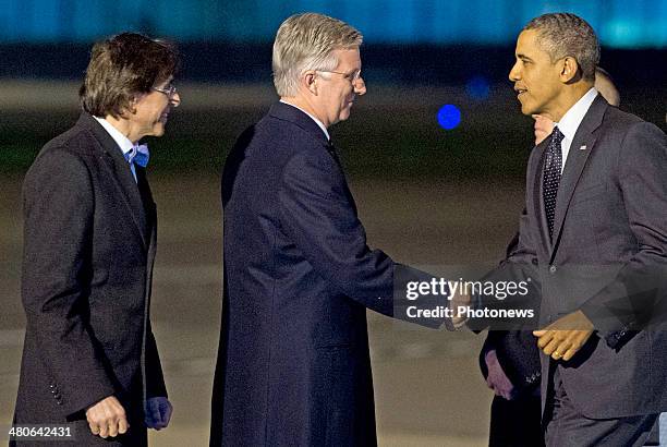 President Barack Obama is welcomed by King Philippe of Belgium and Belgian Prime Minister Elio Di Rupo as he disembarks from Air Force One at...