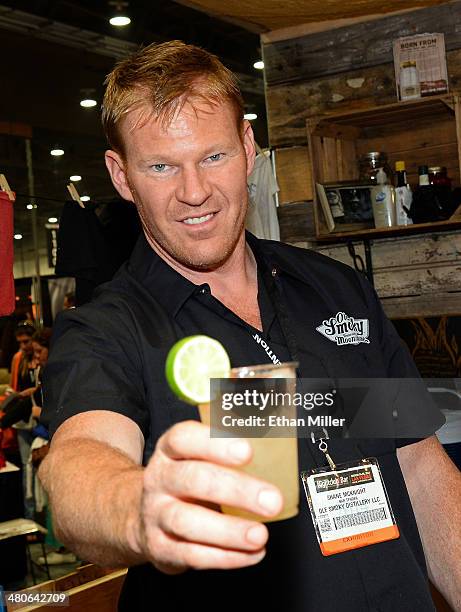 Bartender Shane McKnight poses at the Ole Smoky Tennessee Moonshine booth at the 29th annual Nightclub & Bar Convention and Trade Show at the Las...