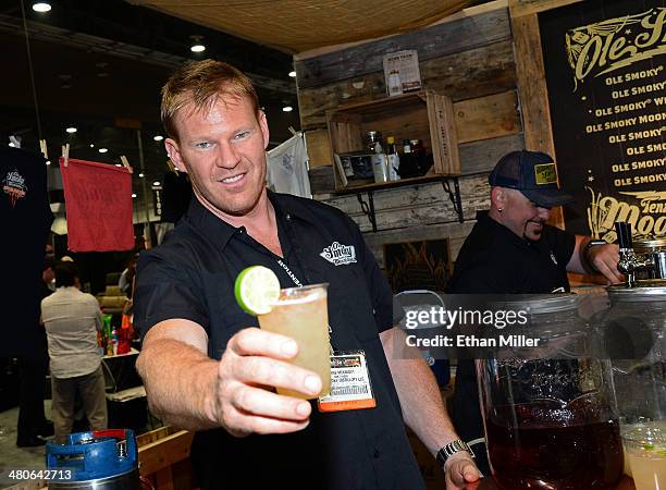 Bartender Shane McKnight poses at the Ole Smoky Tennessee Moonshine booth at the 29th annual Nightclub & Bar Convention and Trade Show at the Las...