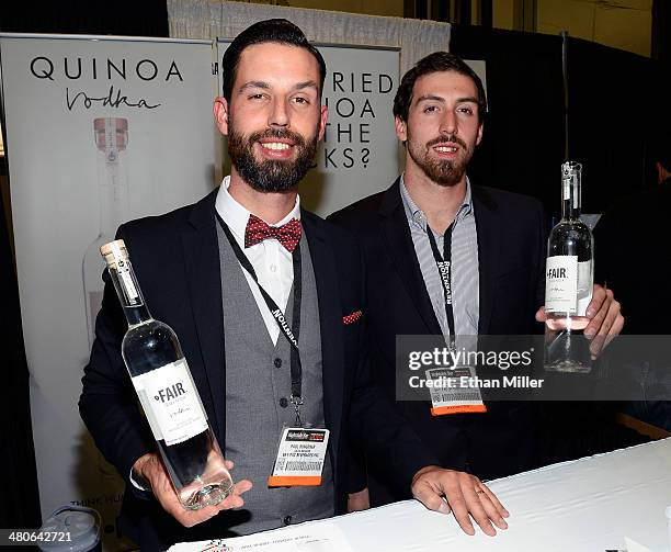 Paul Bungener and Zach Nichols pose at the Fair Spirits booth with their Fair quinoa vodka product at the 29th annual Nightclub & Bar Convention and...