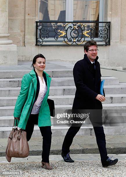 Minister for Equality of Territories and Housing, Cecile Duflot and Junior Minister for Foreign Countries and Development, Pascal Canfin leave after...
