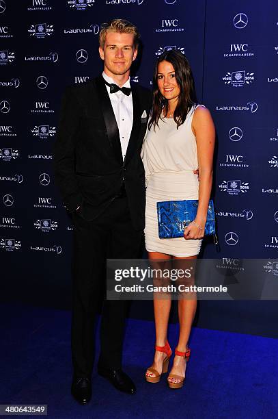 Nico Hulkenberg and girlfriend Laura attend the 2014 Laureus World Sports Awards at the Istana Budaya Theatre on March 26, 2014 in Kuala Lumpur,...