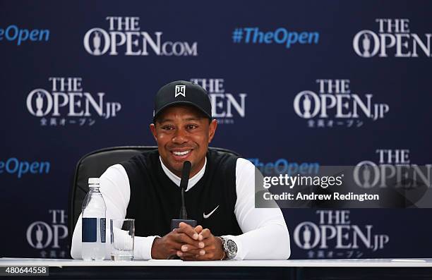 Tiger Woods of the United States smiles during a press conference ahead of the 144th Open Championship at The Old Course on July 14, 2015 in St...