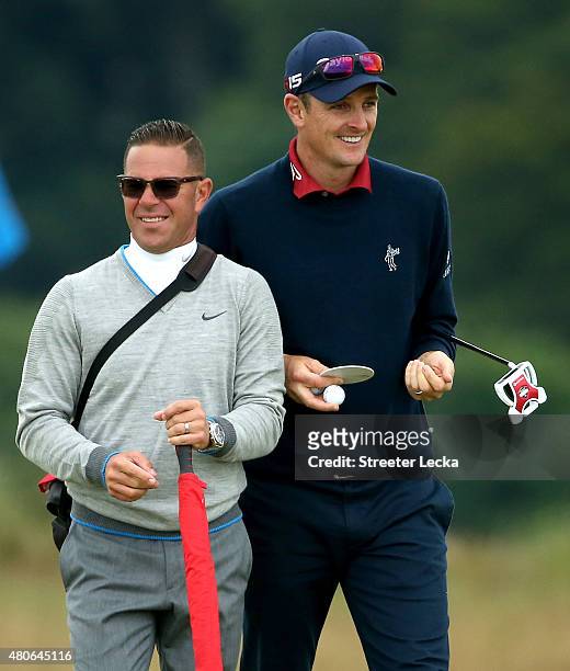 Justin Rose of England and coach Sean Foley look on during practice ahead of the 144th Open Championship at The Old Course on July 14, 2015 in St...