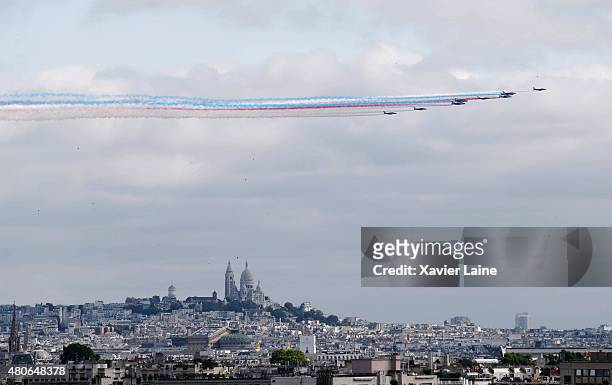 Alpha Jets of the French Air Force, La Patrouille de France, releasing trails of blue, white and red smoke, the colors of the French national flag,...