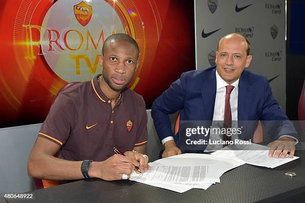 Seydou Keita, with AS Roma General Director Mauro Baldissoni, renews his contract with AS Roma on July 14, 2015 in Rome, Italy.