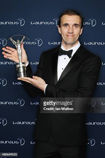 Cyclist Jamie Bestwick winner of the Laureus World Action Sportsperson of the Year award poses with their trophy during the 2014 Laureus World Sports...