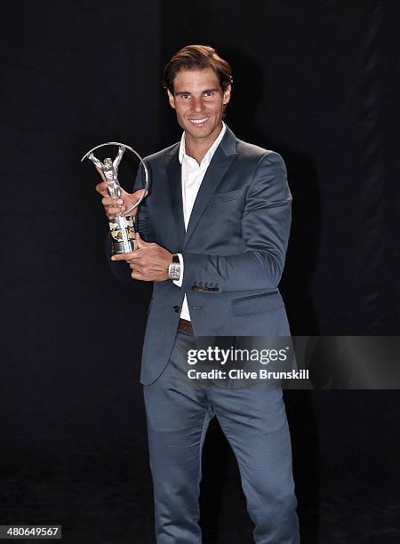 Rafael Nadal winner of the Laureus World Comeback of the Year award poses with their trophy announced at the 2014 Laureus World Sports Awards at the...