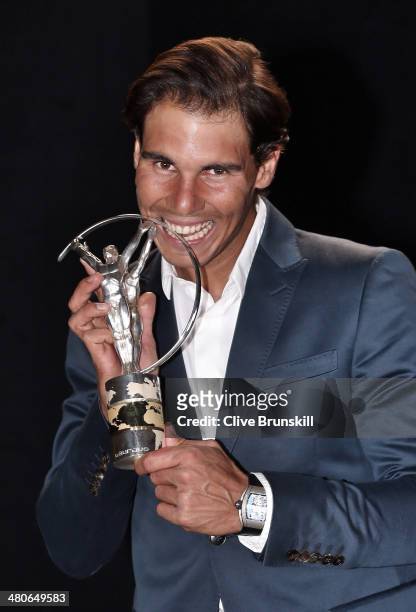 Rafael Nadal winner of the Laureus World Comeback of the Year award poses with their trophy announced at the 2014 Laureus World Sports Awards at the...
