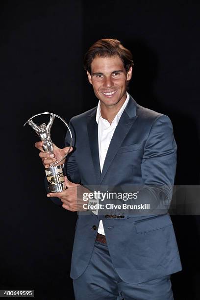 Rafael Nadal winner of the Laureus World Comeback of the Year award poses with their trophy announced at the 2014 Laureus World Sports Awards at the...