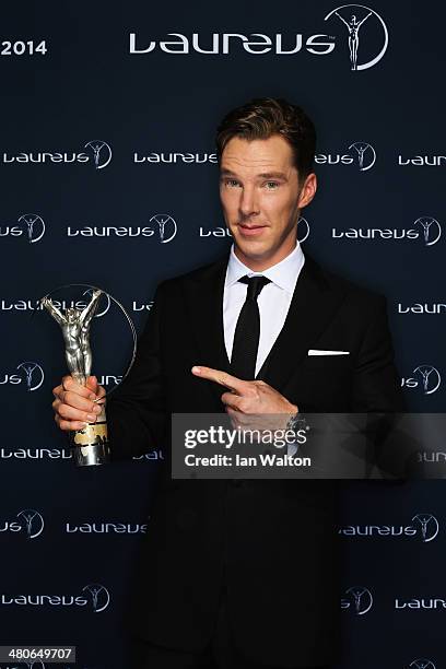 Actor Benedict Cumberbatch poses with the Laureus trophy during the 2014 Laureus World Sports Awards at the Istana Budaya Theatre on March 26, 2014...